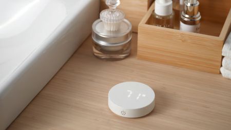 The IKEA TIMMERFLOTTE device next to a bathroom sink