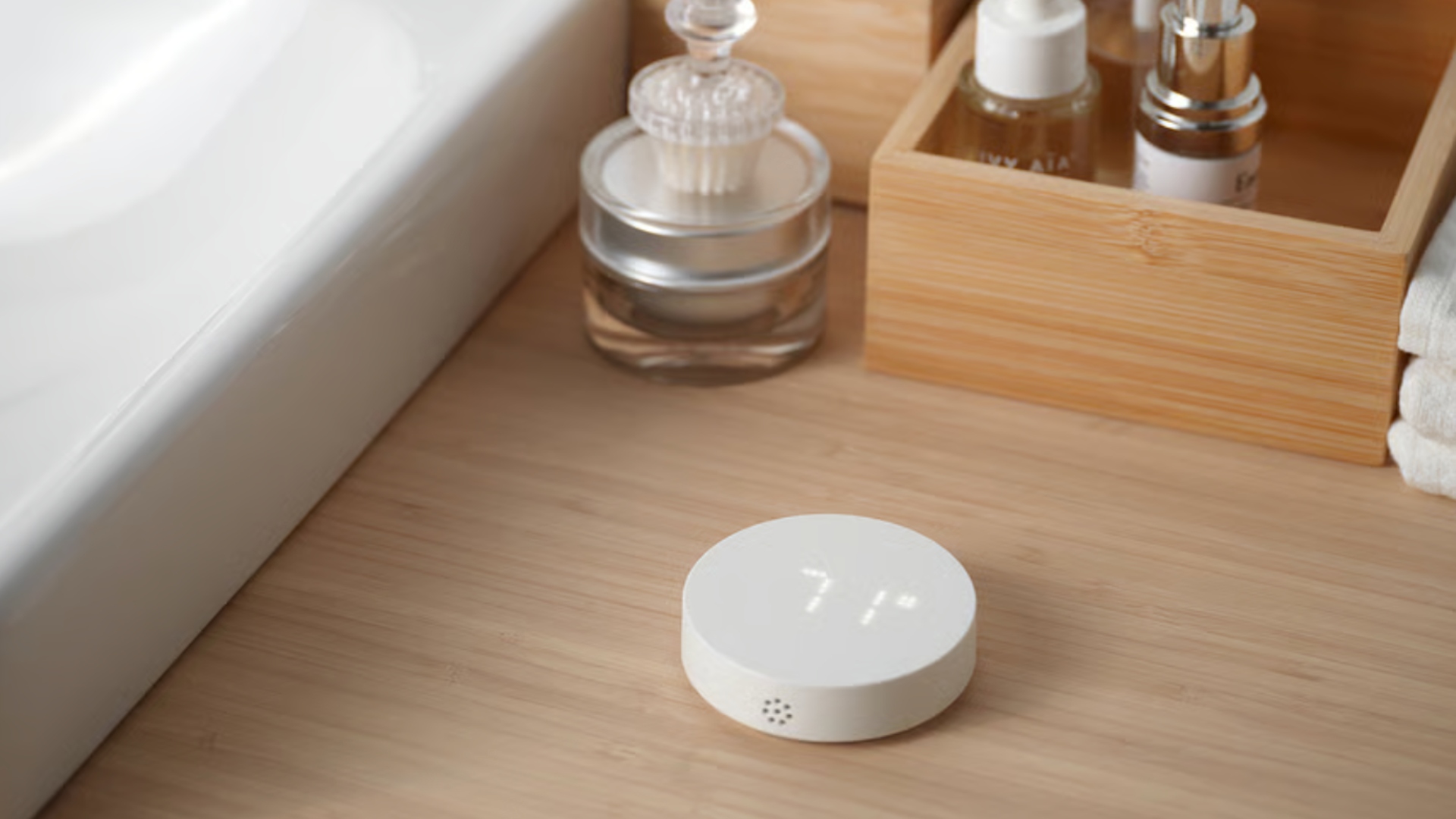 The IKEA TIMMERFLOTTE device next to a bathroom sink