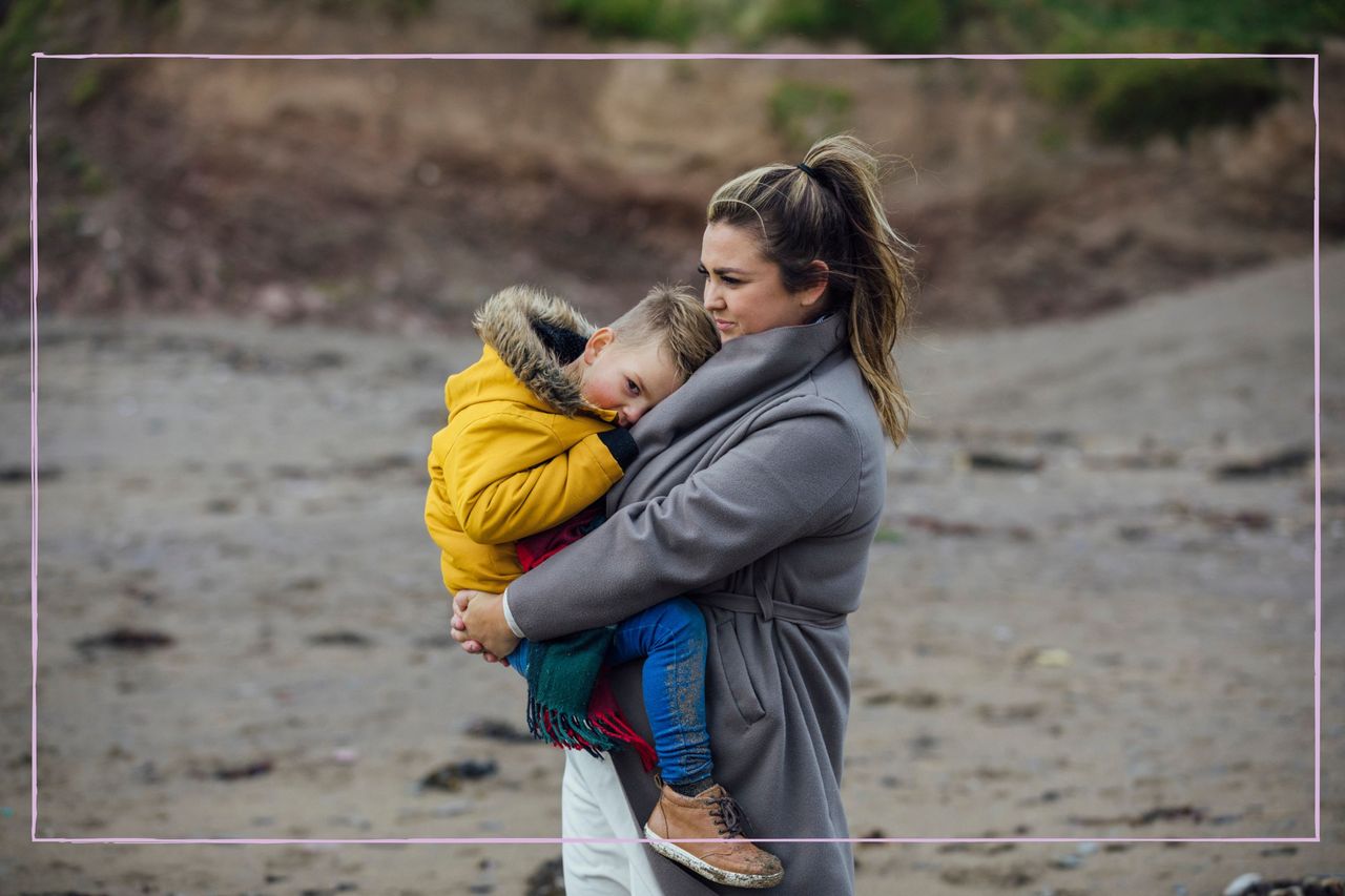 Lonely mother on the beach with her child