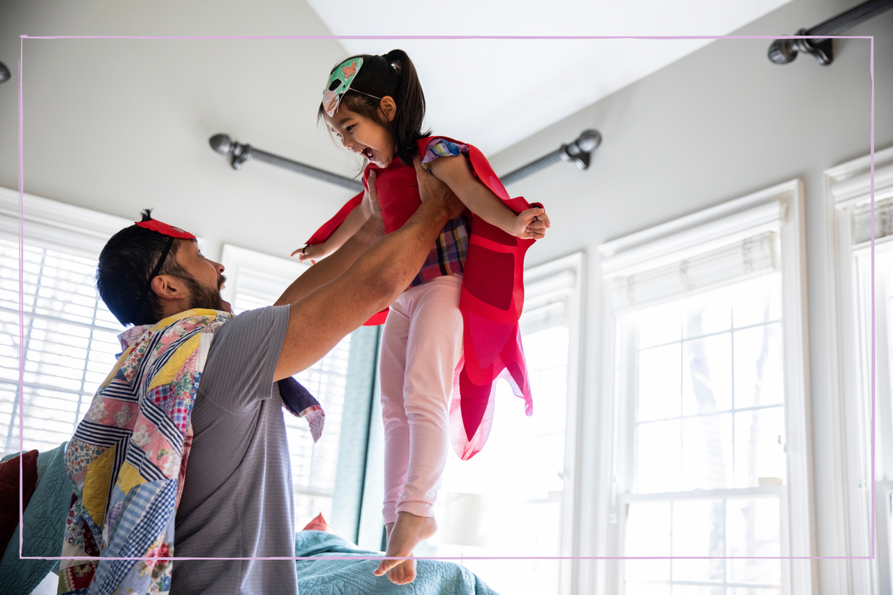 Father and daughter playing in costumes 