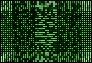 Close-up of computer screen displaying green zeroes and ones