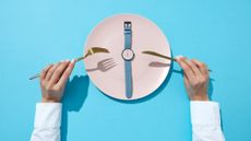 The 5:2 diet: a watch on a plate demonstrates intermittent fasting