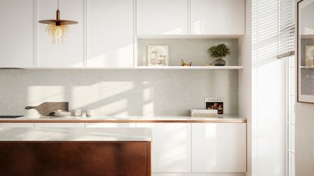 White kitchen cabinets with wood accents and pendant light. 