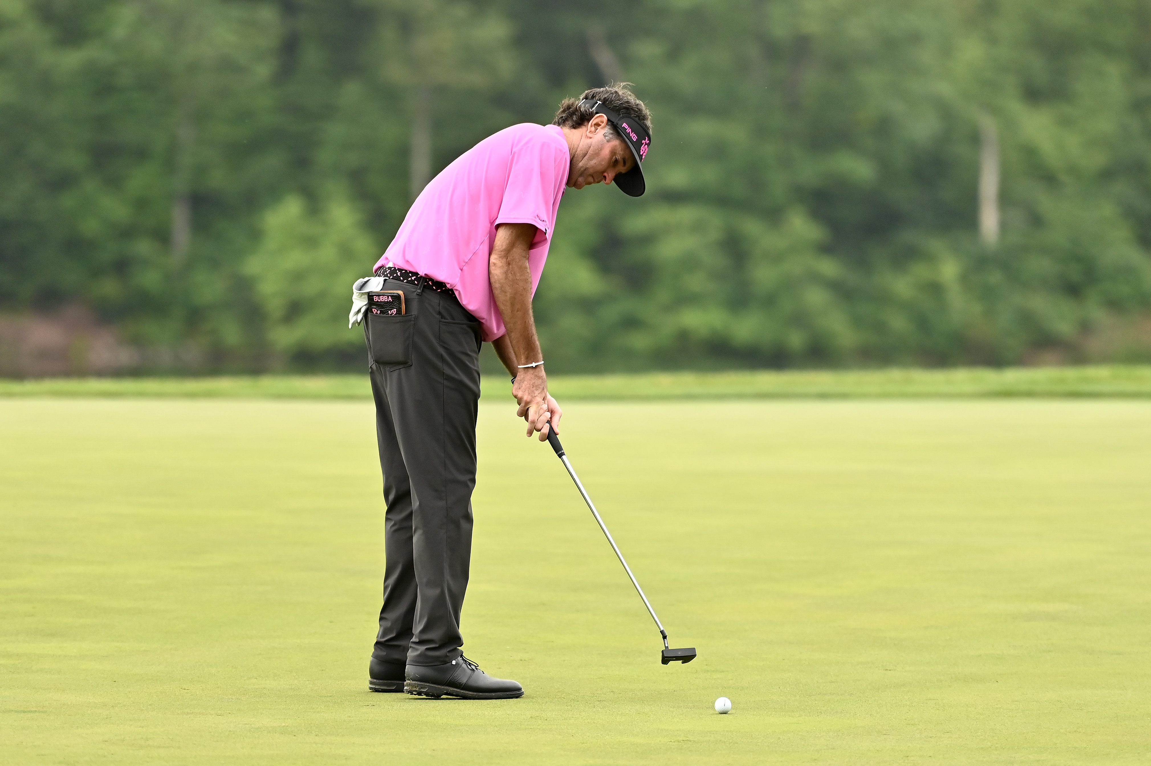 Bubba Watson hits a putt