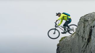 Mounyain biker riding of mountain in Wales