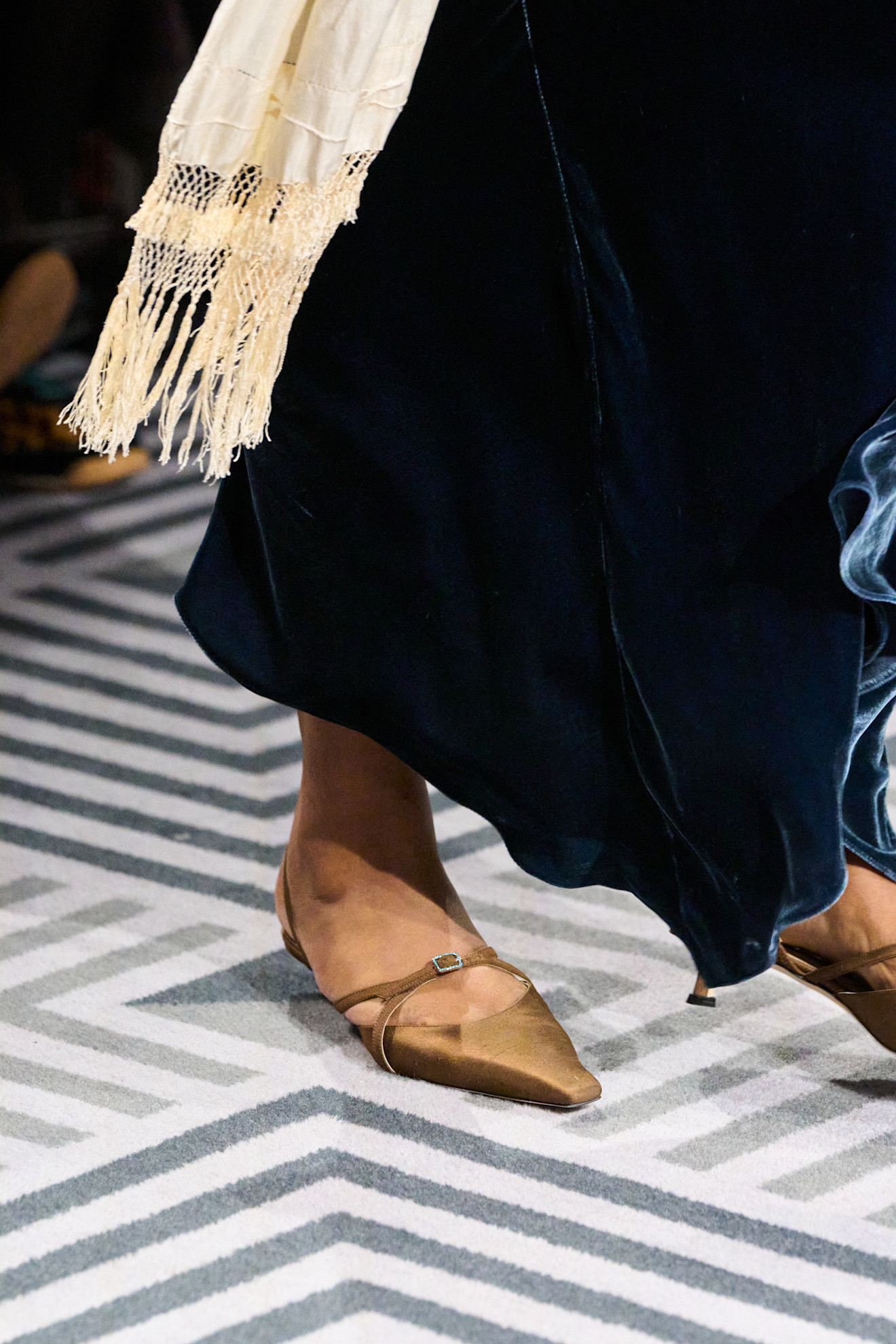 Detail image of a satin shoe on the fall/winter 2026 runway.