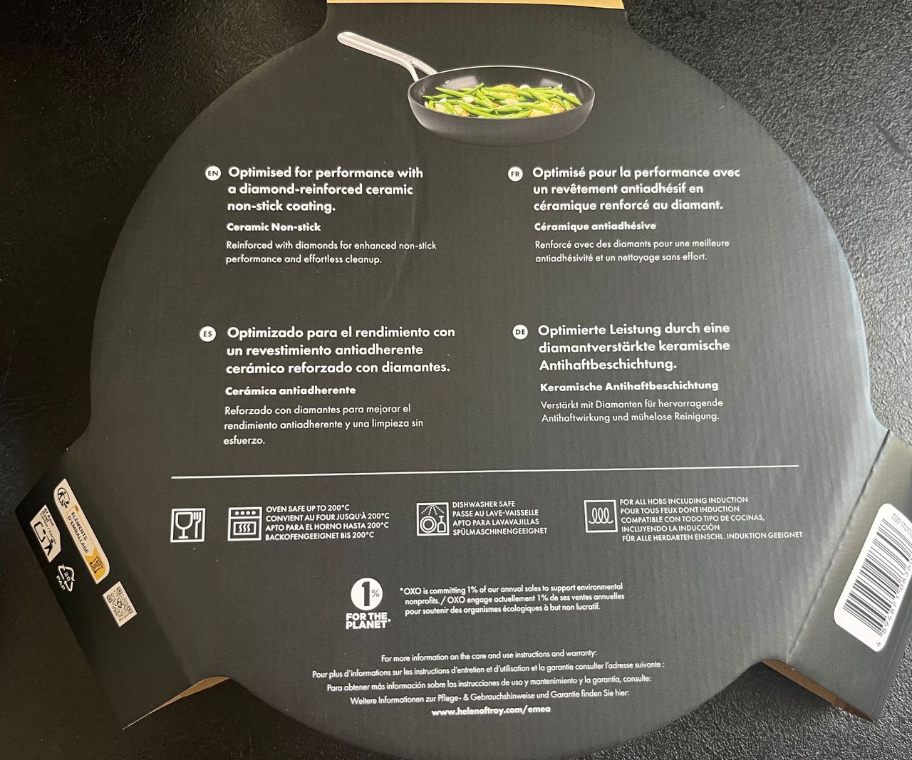 Instructions for a ceramic frying pan on a black countertop