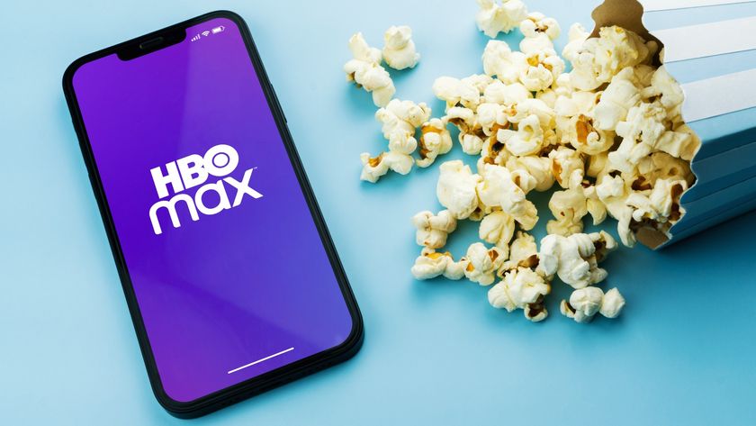 HBO Max logo on phone next to popcorn