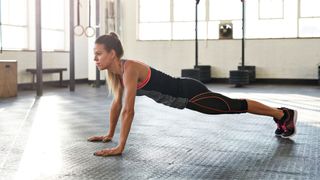 Woman in high plank