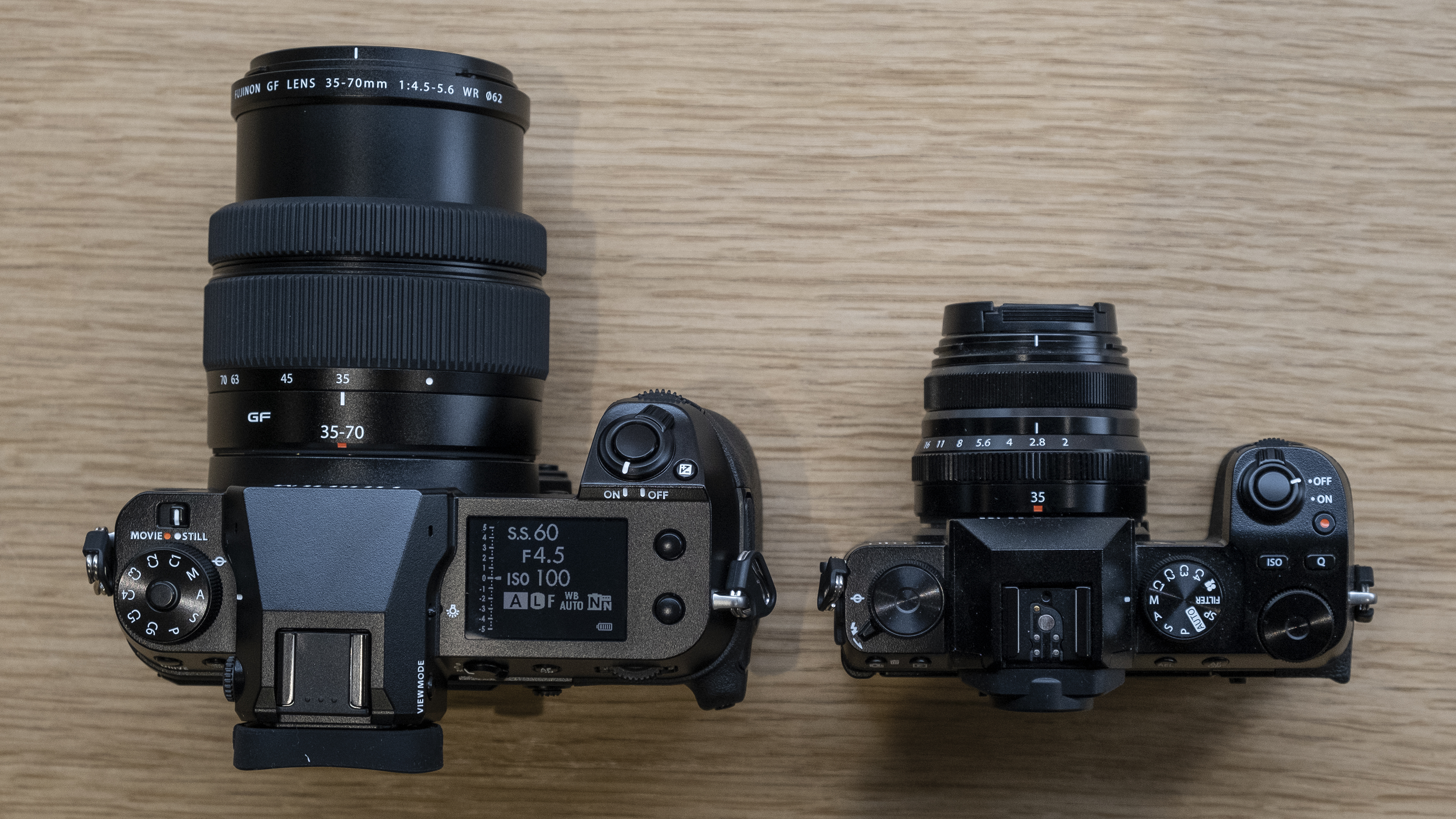 The Fujifilm GFX50S II on a wooden table