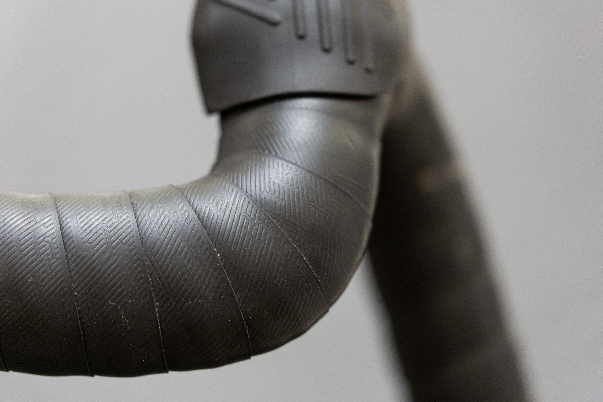 The subtly branded ENVE Bar Tape neatly wrap by Tim in black.
