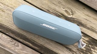 Bose SoundLink Flex on wooden surface