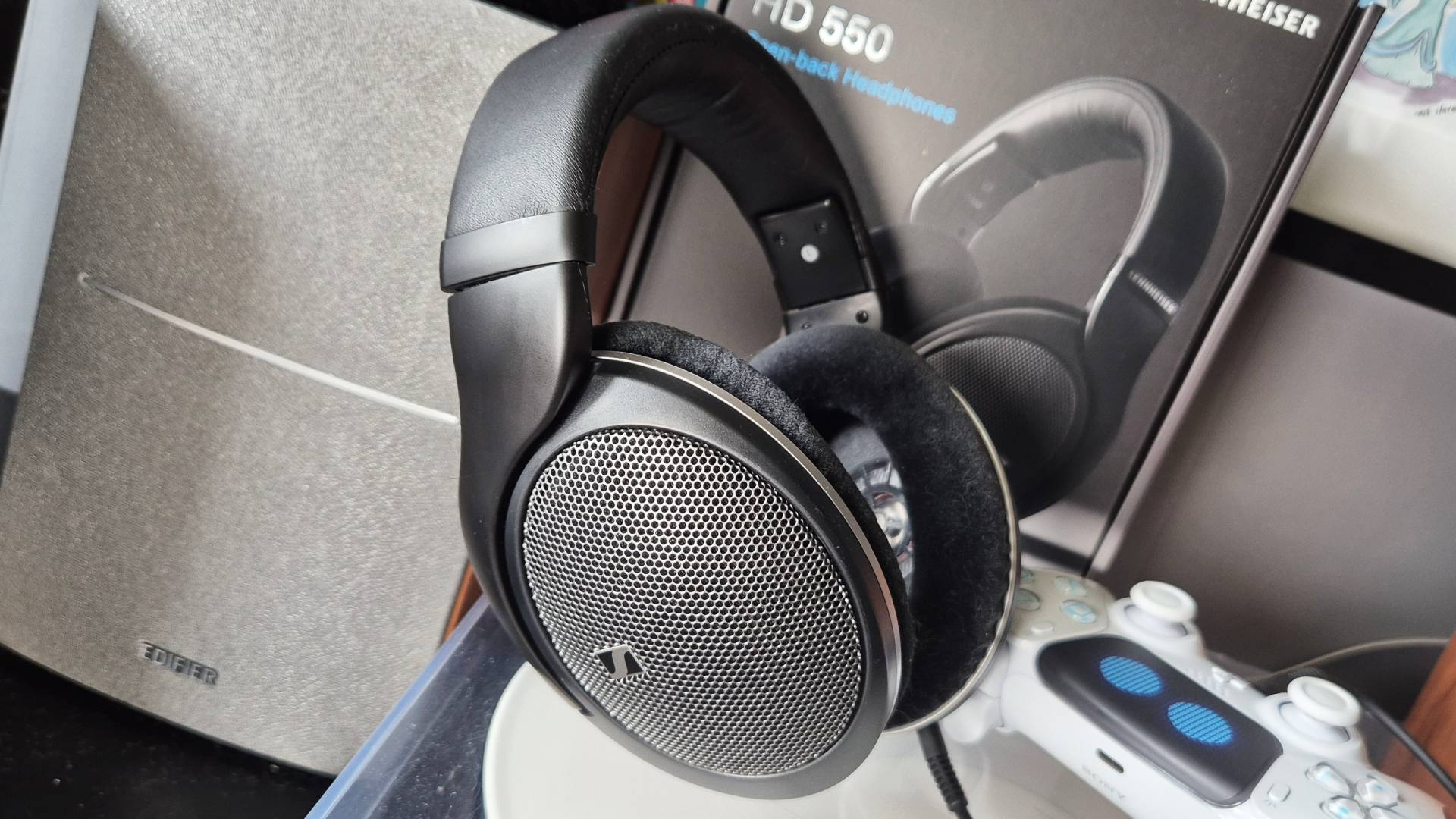 Photo of the Sennheiser HD 550 headphones, sitting on a record turntable, taken by writer Rosalie Newcombe.