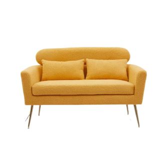 A yellow boucle sofa