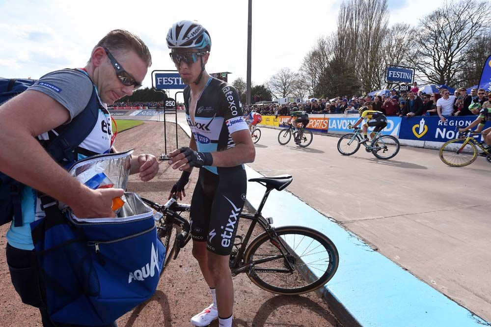 A defeated Nikki Terpstra takes a drink after the race