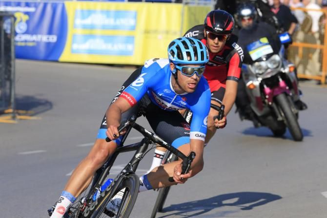 Breakaway riders Jack Bauer (Garmin-Sharp) and Steve Morabito (BMC) try to hold off the peloton in the stage 6 finale