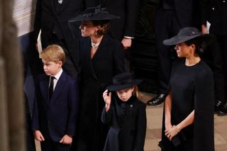 atherine, Princess of Wales, Princess Charlotte of Wales, Prince George of Wales and Meghan, Duchess of Sussex arrive at Westminster Abbey for the State Funeral of Queen Elizabeth II on September 19, 2022 in London, England.