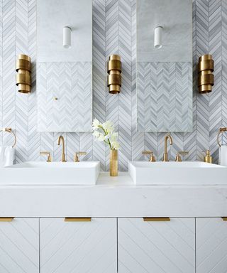 white bathroom with brass fixtures