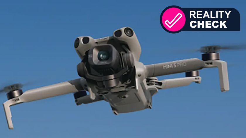 The DJI Mini 5 Pro drone flying in a blue sky