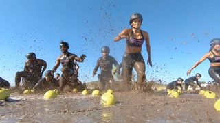 The Challenge season 38 contestants running through the mud