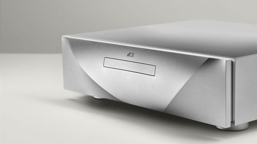 A silver dCS Varese Transport CD player at a 3/4 angle on a white background.