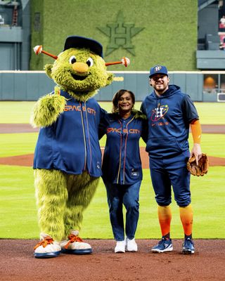 NASA Johnson Space Center director Vanessa Wyche with Houston Astros mascot Orbit and outfielder Chas McCormick at Minute Maid Park in Houston, Texas on May 2, 2022.