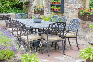 metal dining furniture in a terrace area of a garden