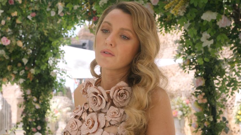 Blake Lively stands nonchalantly while wearing a Tamara Ralph halter top in Another Simple Favor.