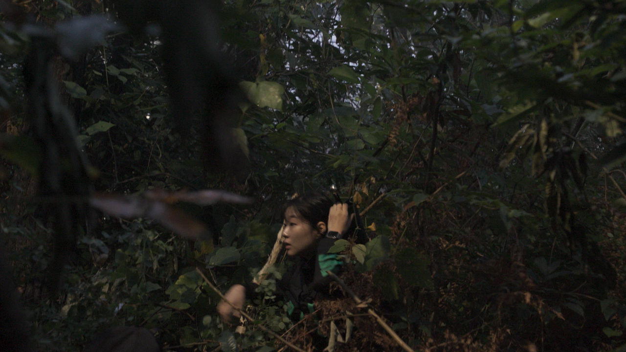 One Siren: Survive the Island contestant hiding in foliage