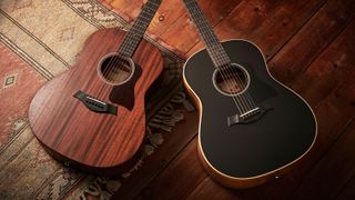 Two Taylor acoustic guitars lying on a rug