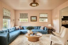 colors that make a living room look bigger; blush pink living room by Bunsa Studio