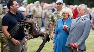 Queen Camilla, King Charles and a bird of prey