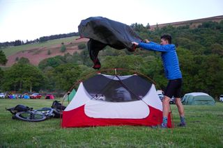 Stefan Abram putting up a tent at the Elan Oaks campsite along the Trans Cambrian Way.