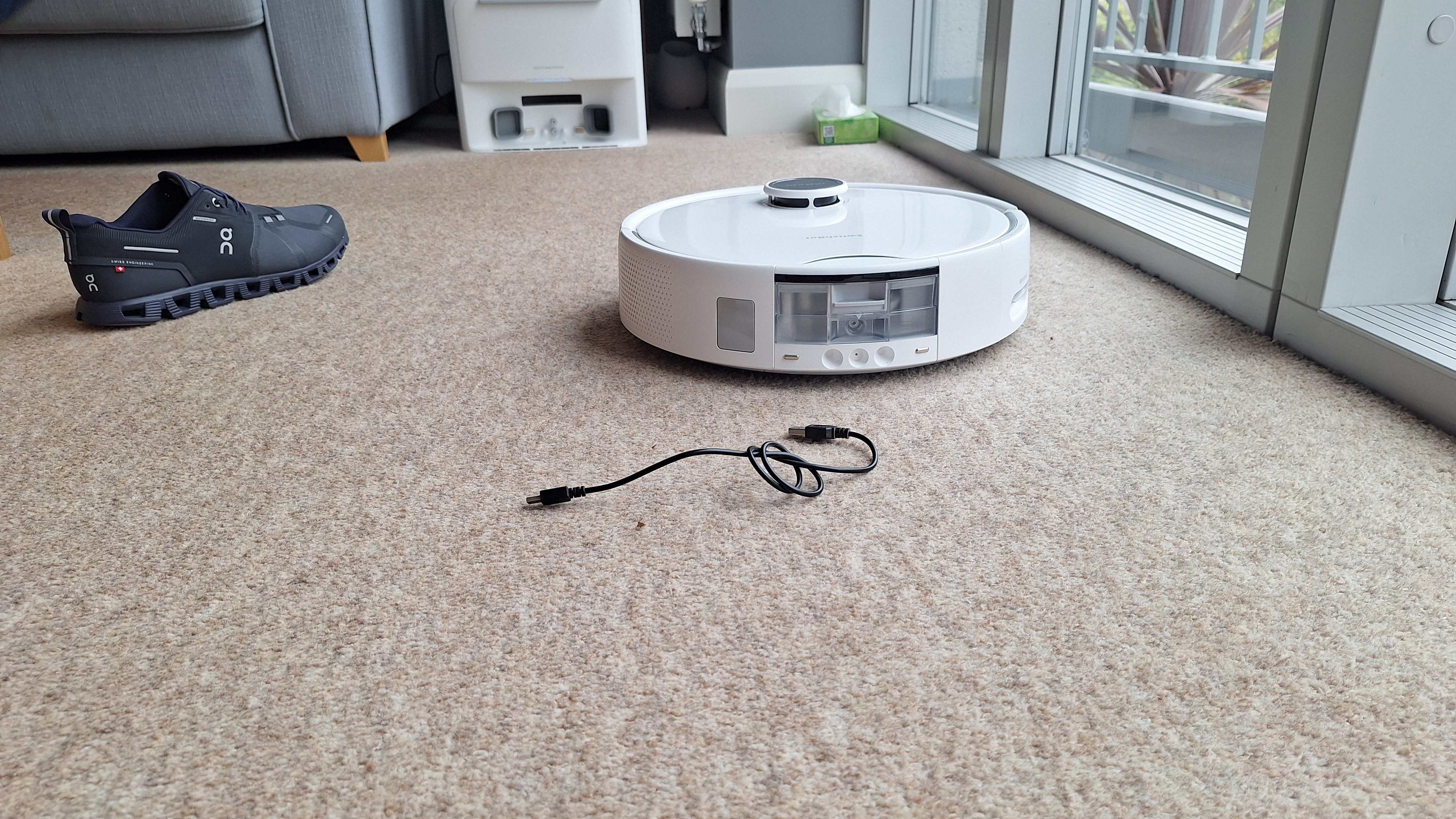 Shoe, cable and tissue box laid out for object avoidance test