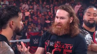 Sami Zayn addresses Jey Uso during a disagreement in the ring.