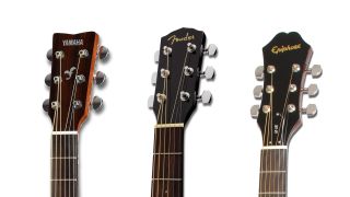 Headstocks of three beginner acoustic guitars