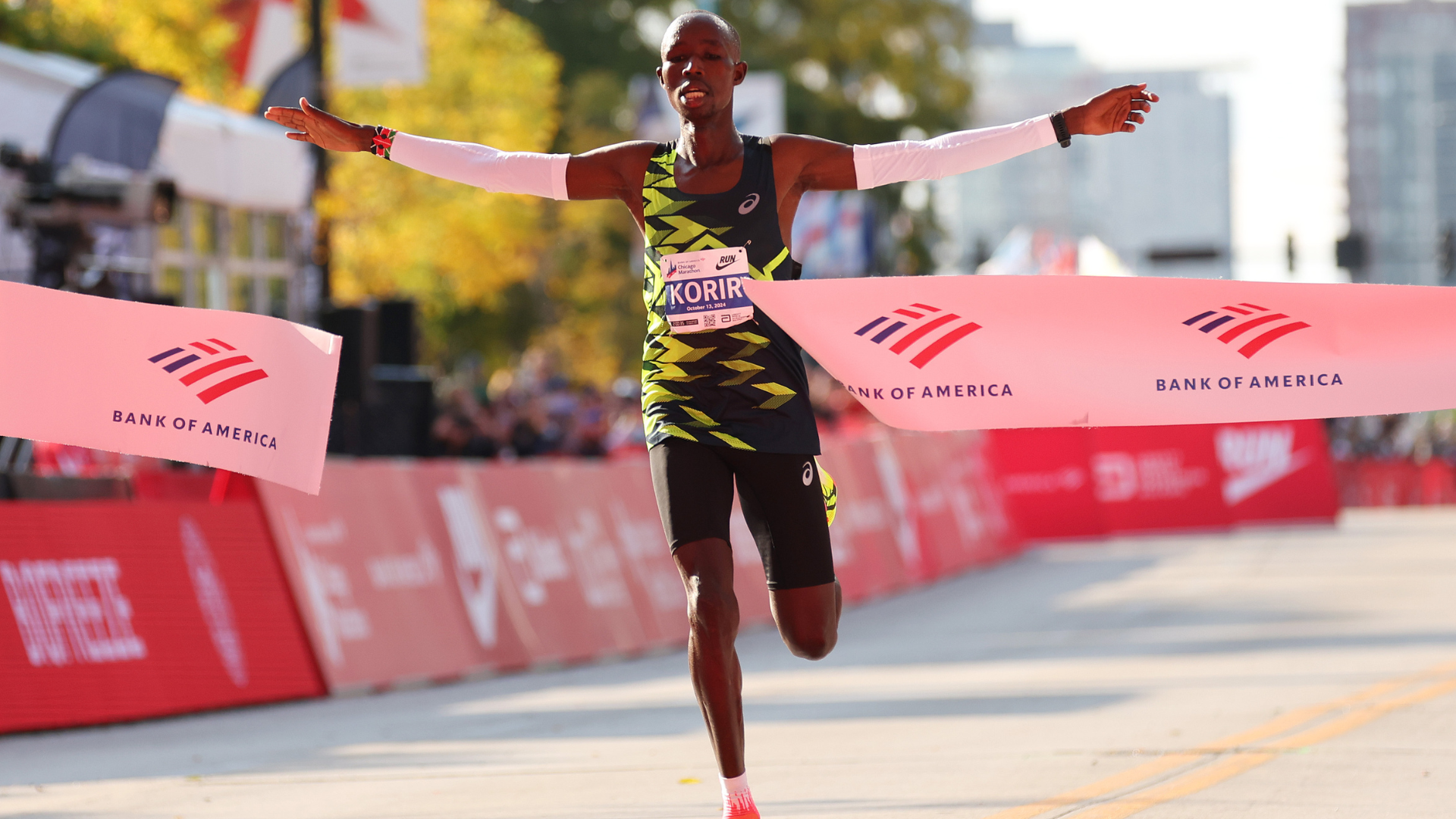 John Korir of Kenya celebrates as he crosses the finish line to win the 2024 Chicago Marathon professional men's division at Grant Park on October 13, 2024 in Chicago, Illinois. 