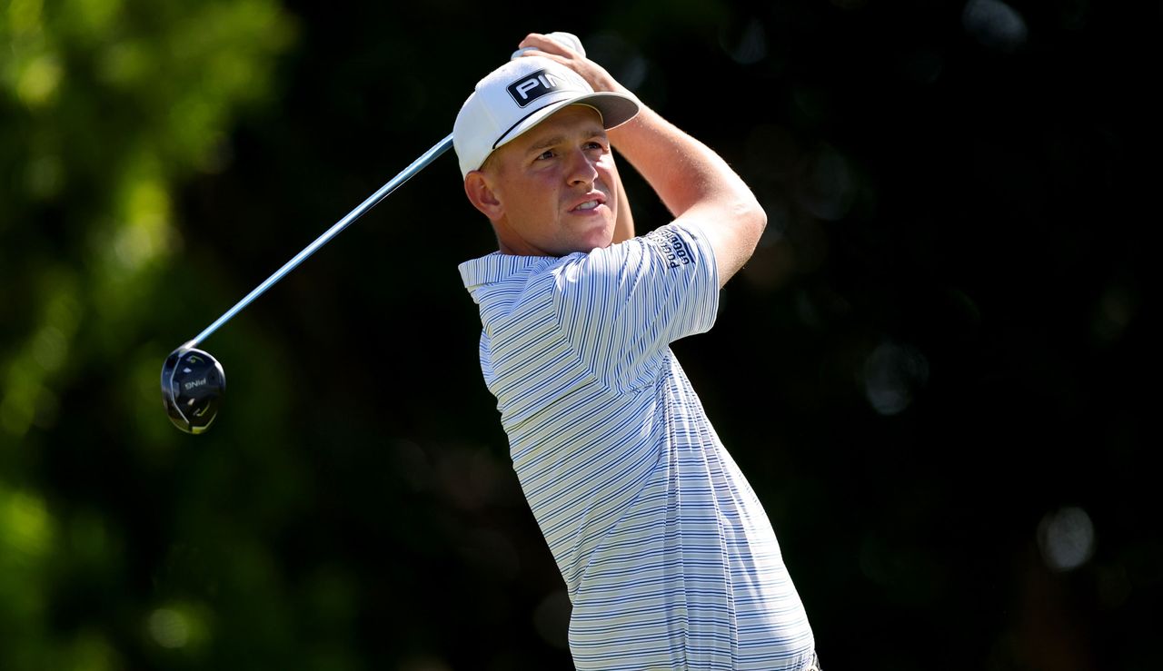 Sam Stevens strikes a fairway wood shot and watches its flight