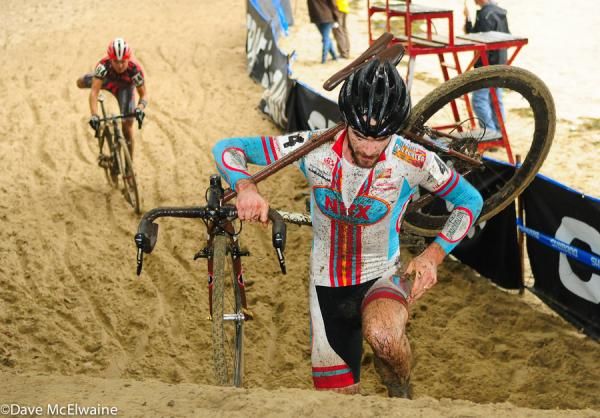 A racer climbs the sandy stairs