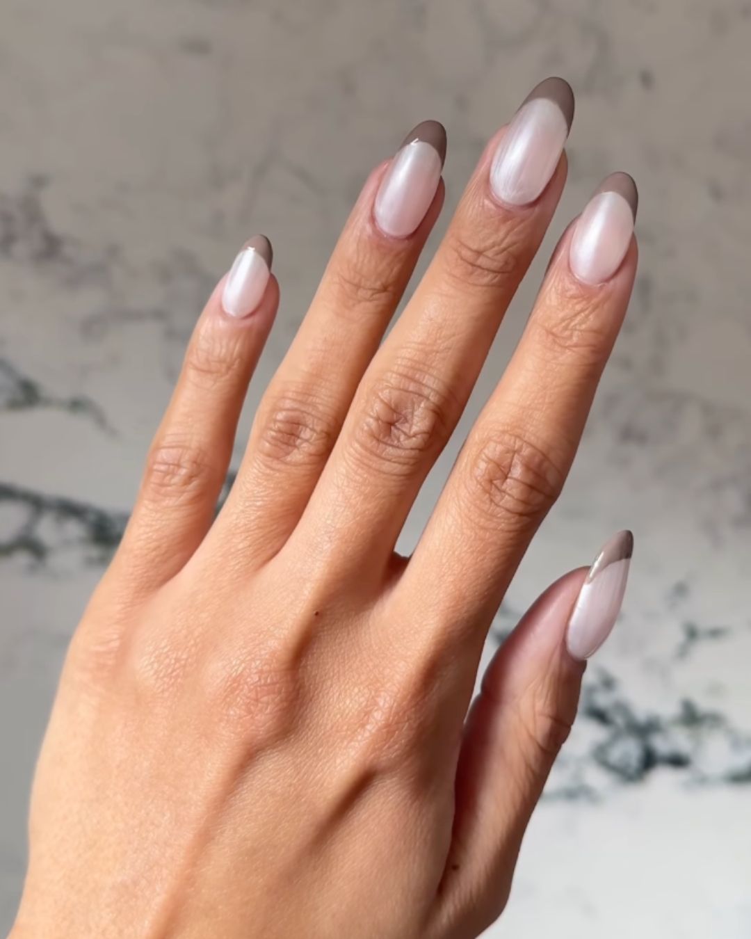 An image of pearlescent nails.