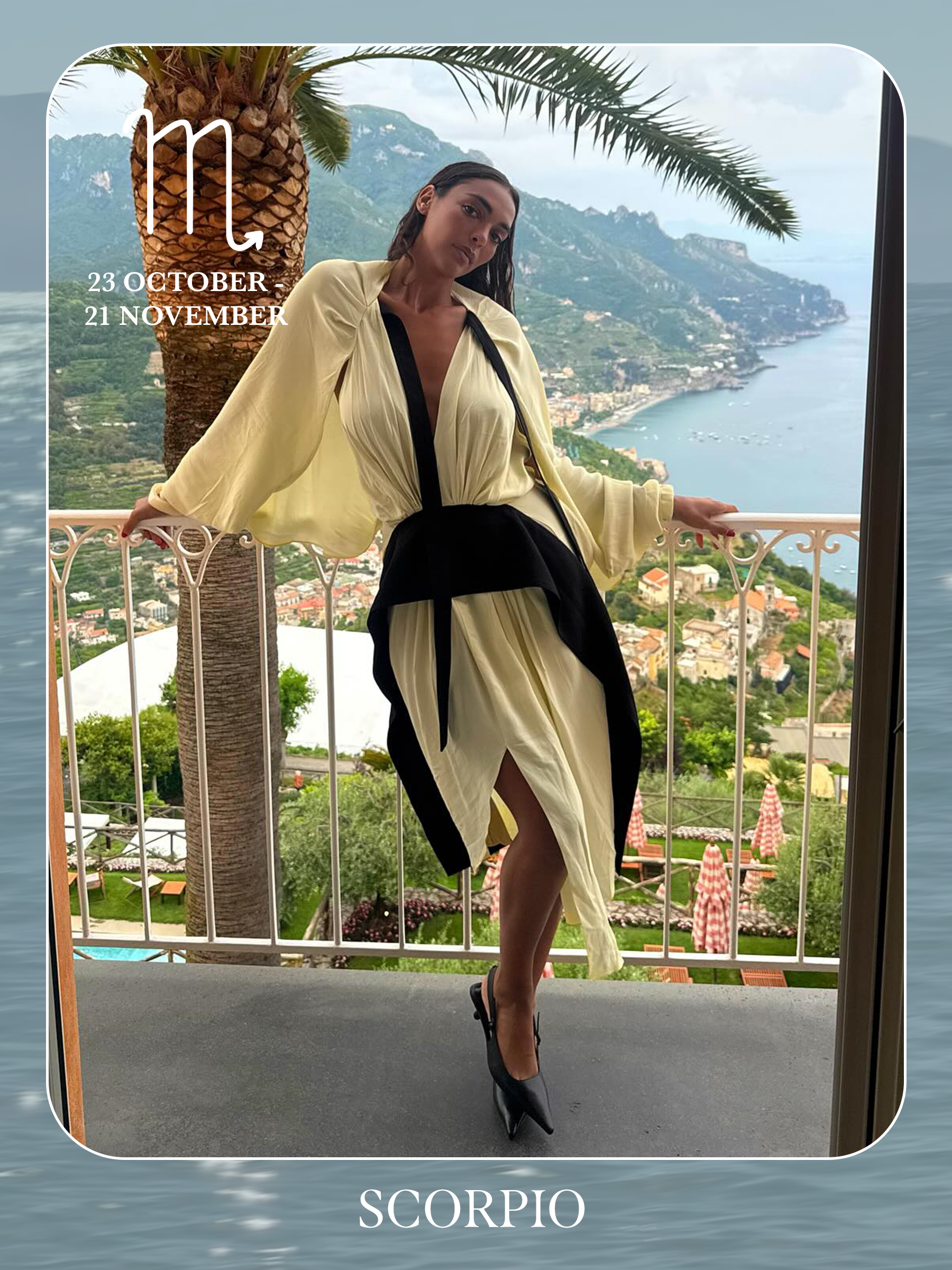 An image of @sandrashehab posing on a beach wearing a striped maxi dress, showcasing the characteristics of sun sign dressing if you're a Scorpio.