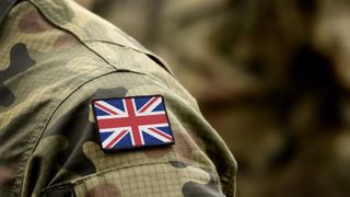 A close up of a Union flag on the shoulder of a soldier's uniform