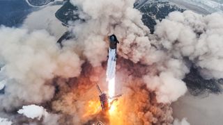 a massive silver rocket lifts off above a plume of fire