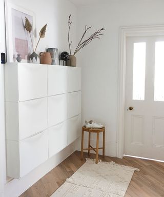 living room with wooden flooring and white door