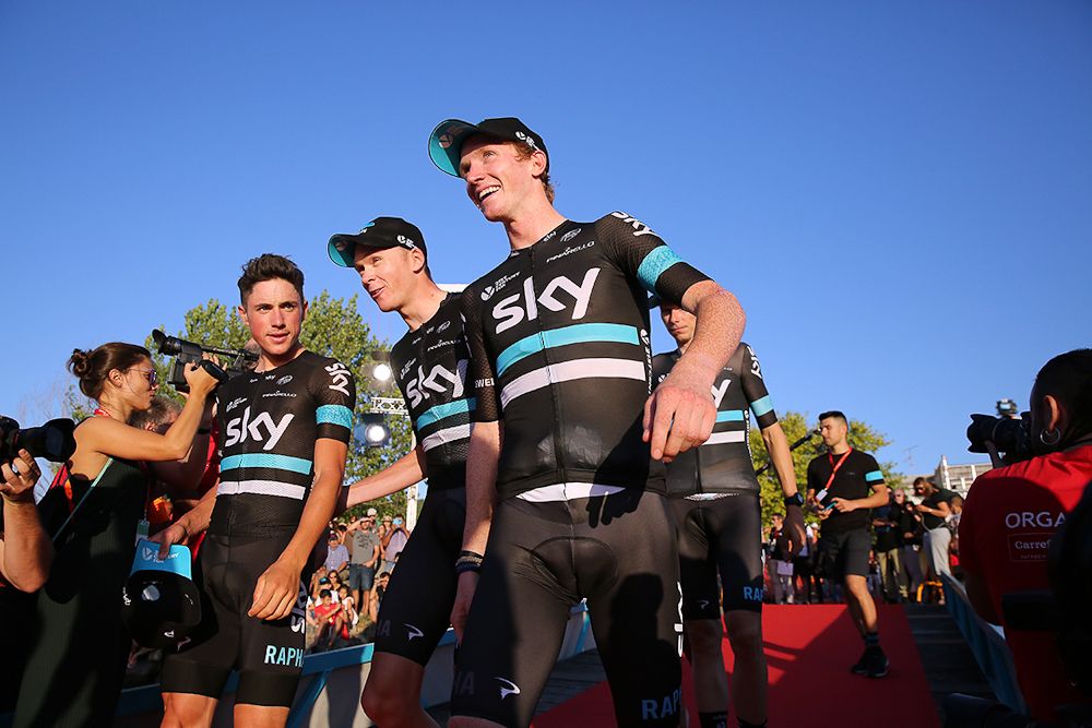 Team Sky riders celebrate on the Vuelta's stage 1 podium.