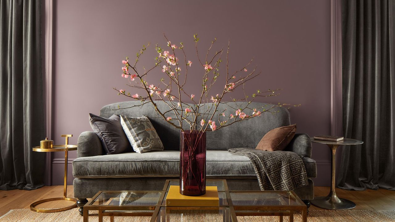 Living room painting in Benjamin Moore&#039;s Cinnamon Slate with a grey velvet sofa