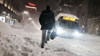 A bomb cyclone dumped snow across the Northeast in January 2018 as well. Here, a man walks through the streets of Boston as snow falls from the massive winter storm on Jan. 4, 2018 in Boston.