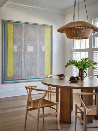 A dining room with round dining table