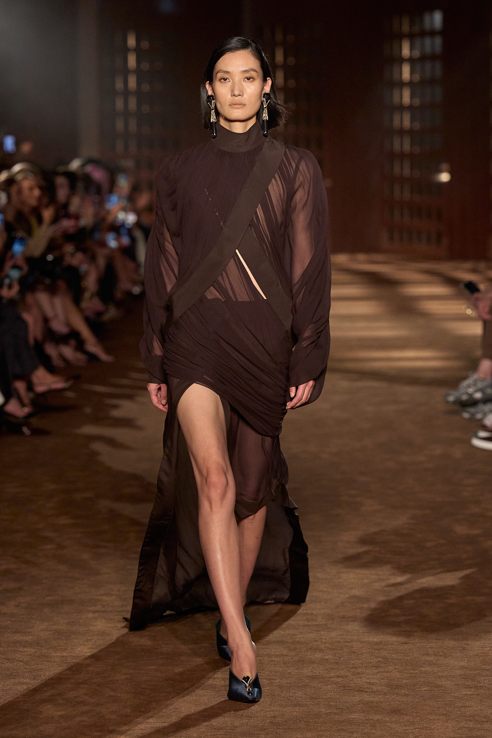 a model walks the ferragamo spring 2027 runway.
