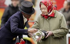WINDSOR, UNITED KINGDOM - MAY 14: (EMBARGOED FOR PUBLICATION IN UK NEWSPAPERS UNTIL 48 HOURS AFTER CREATE DATE AND TIME) Katie Jerram and Queen Elizabeth II inspect the trophy that Queen Elizabeth was presented after Katie won the 'Ladies Side Saddle' class on Queen Elizabeth's horse 'Stardust III' during day 3 of the Royal Windsor Horse Show on May 14, 2010 in Windsor, England. (Photo by Indigo/Getty Images) *** Local Caption *** Katie Jerram;Queen Elizabeth II